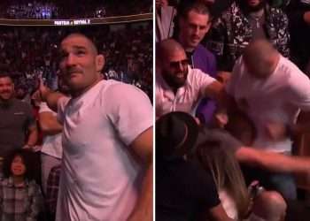 Watch as ‘psychopath’ Sean Strickland asks child to move before ATTACKING rival in crazy UFC 296 crowd brawl