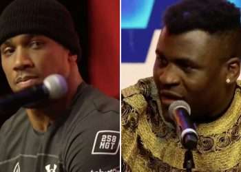 Anthony Joshua looks stony-faced as he glares at Francis Ngannou after ex-UFC champ’s taunts over his chin