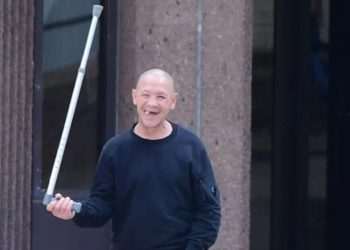 Moment smiling criminal with 56 convictions twirls can as he walks free | UK | News